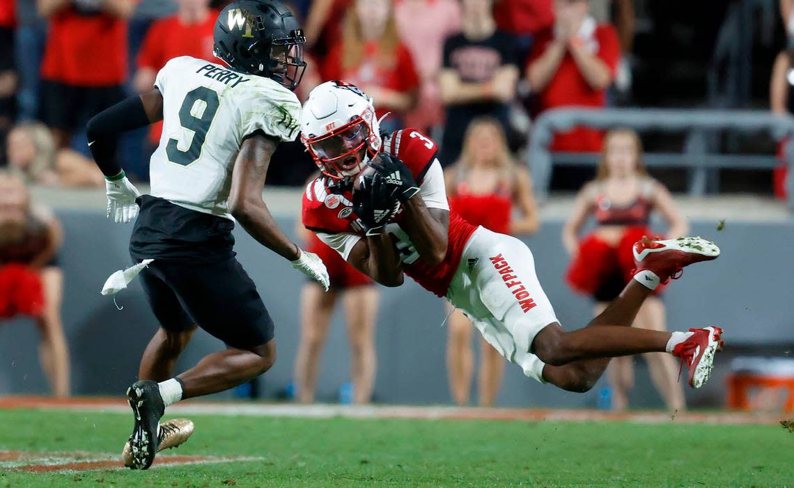 N.C. State’s Aydan White (3) intercepts the ball intended for Wake Forest wide receiver A.T. Perry (9) during the second half of N.C. State’s 30-21 victory over Wake Forest at Carter-Finley Stadium in Raleigh, N.C., Saturday, Nov. 5, 2022.