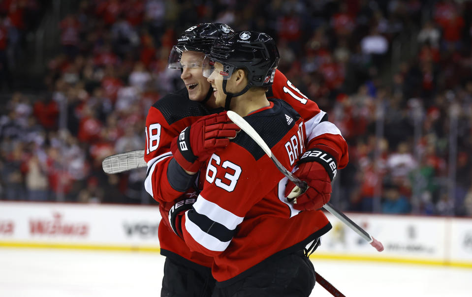 New Jersey Devils Ondrej Palat congratulates Jesper Bratt (63) for a goal against the Colorado Avalanche during the second period of an NHL hockey game Tuesday, Feb. 6, 2024, in Newark, N.J. (AP Photo/Noah K. Murray)