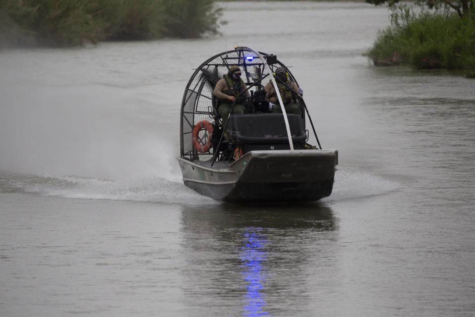 A border Patrol boat navigates the Rio Grande river near Eagle Pass, Texas, Sunday May 22, 2022. Little has changed in what has quickly become one of the busiest corridors for illegal border crossings since a federal judge blocked pandemic-related limits on seeking asylum from ending Monday. (AP Photo/Dario Lopez-Mills)