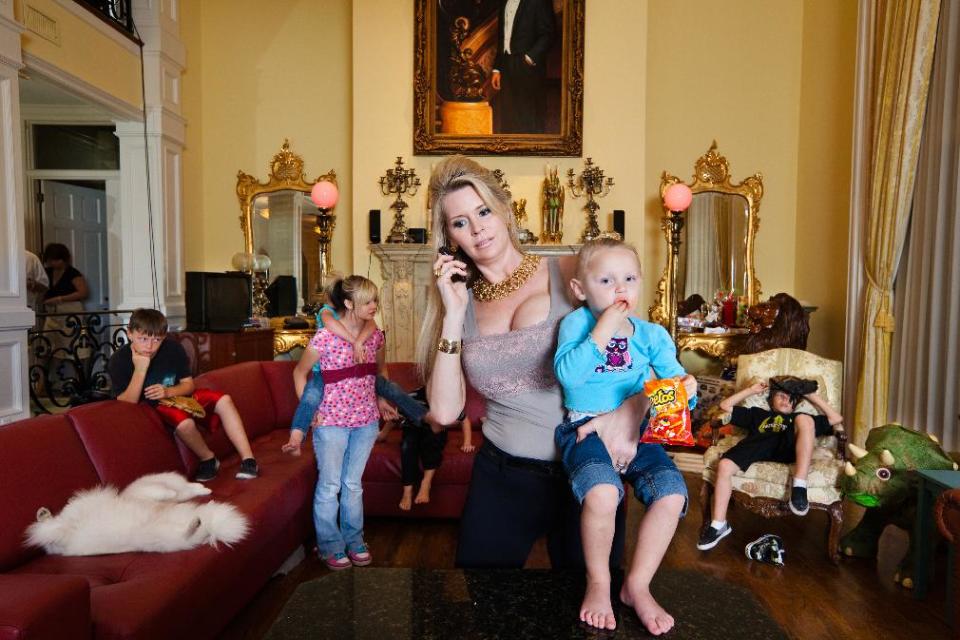 This image released by Magnolia Pictures shows Jackie Siegel and her children from the documentary "The Queen of Versailles." (AP Photo/Magnolia Pictures, Lauren Greenfield)