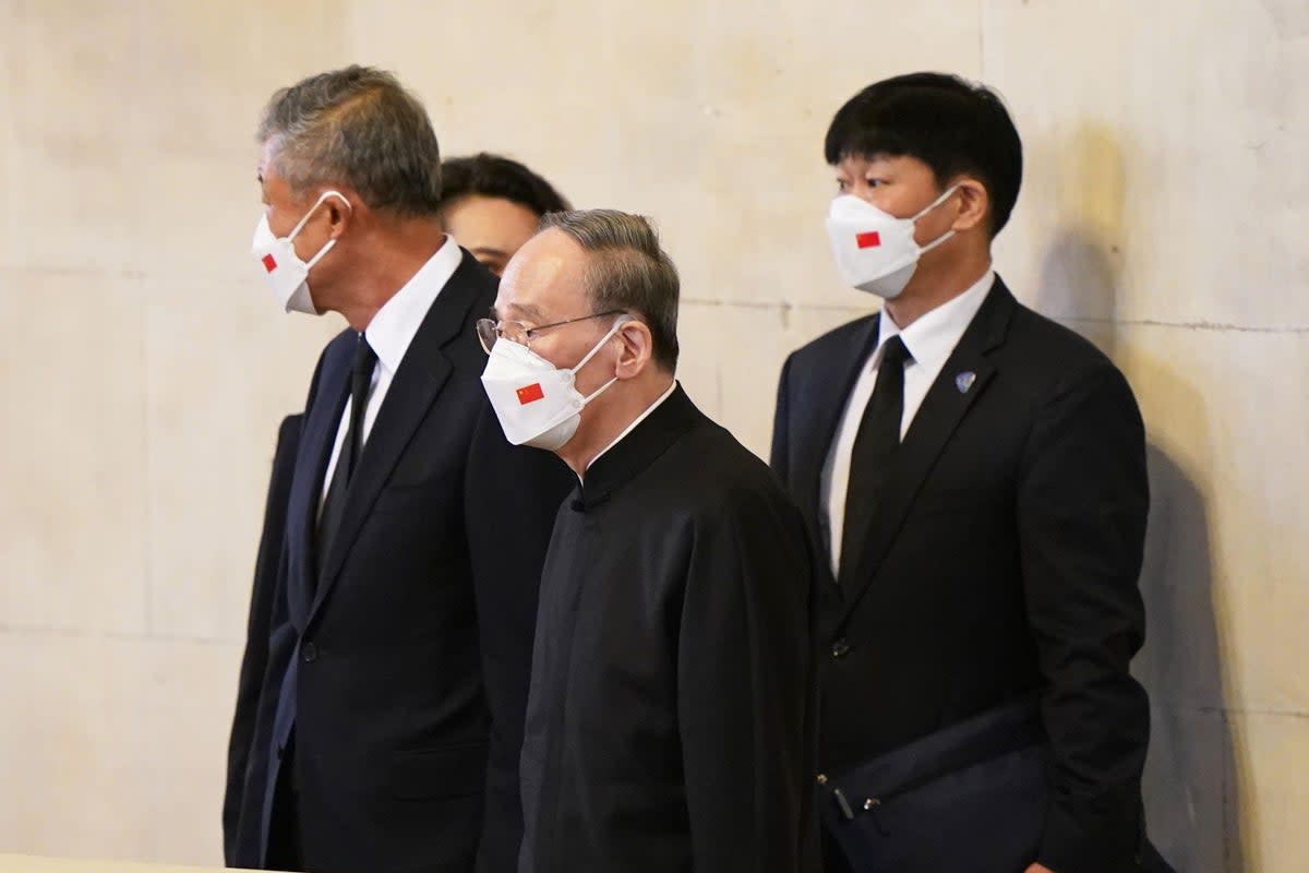 A Chinese delegation view the coffin of Queen Elizabeth II (Joe Giddens/PA) (PA Wire)