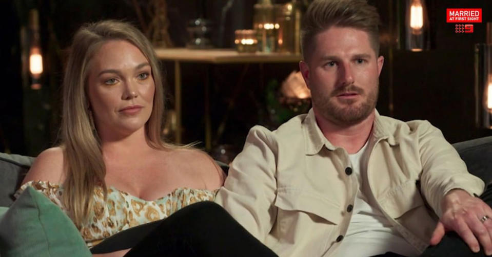 Married At First Sight's Bryce and Melissa on the couch