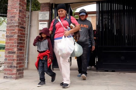 Honduran migrant Denia Carranza, 24, and her son Robert, 7, who have given up their U.S. asylum claim under the Migrant Protection Protocol (MPP), leave Casa del Migrante migrant shelter to board a bus, in Ciudad Juarez