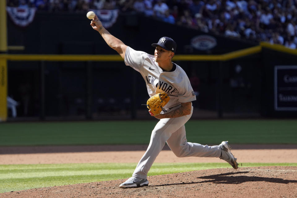 New York Yankees pitcher Jonathan Loáisiga throws against the Arizona Diamondbacks in the ninth inning during a baseball game, Wednesday, April 3, 2024, in Phoenix. Loáisiga said he needs season-ending elbow surgery and will be sidelined for 10-to-12 months. The29-year-old right-hander, said he felt a pop in his elbow while throwing a changeup to Jorge Barrosa, his final batter in the ninth inning of Wednesday's 6-5, 11-inning win at Arizona. (AP Photo/Rick Scuteri)