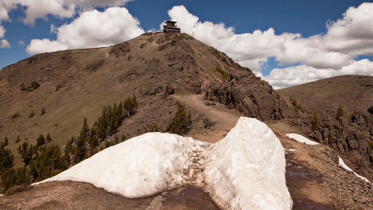 <span class="article__caption">The trail leading to the summit of Mount Washburn and the lookout station used by park rangers to scan for forest fires, in Yellowstone National Park, Wyoming.</span> (Photo: searagen/Getty)