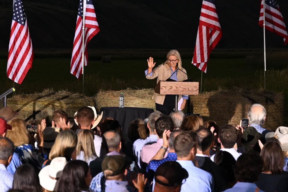 iz Cheney (R-WY) waves as she speaks to supporters at an election night event during the Wyoming primary election at Mead Ranch in Jackson, Wyoming on August 16, 2022.