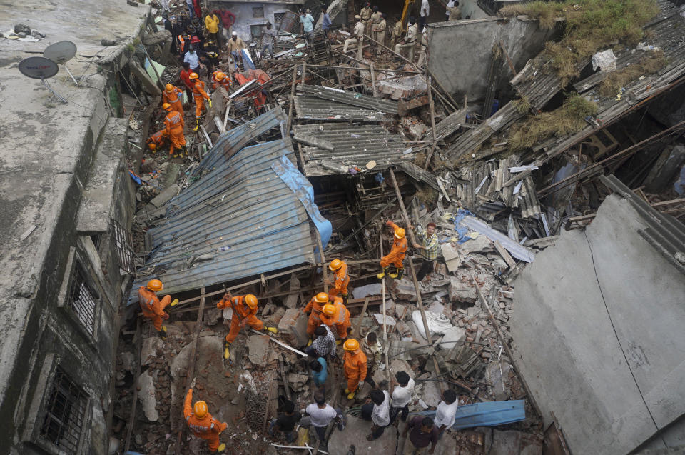 Rescuers look for survivors after a residential building collapsed in Bhiwandi in Thane district, a suburb of Mumbai, India, Monday, Sept.21, 2020. (AP Photo/Praful Gangurde)