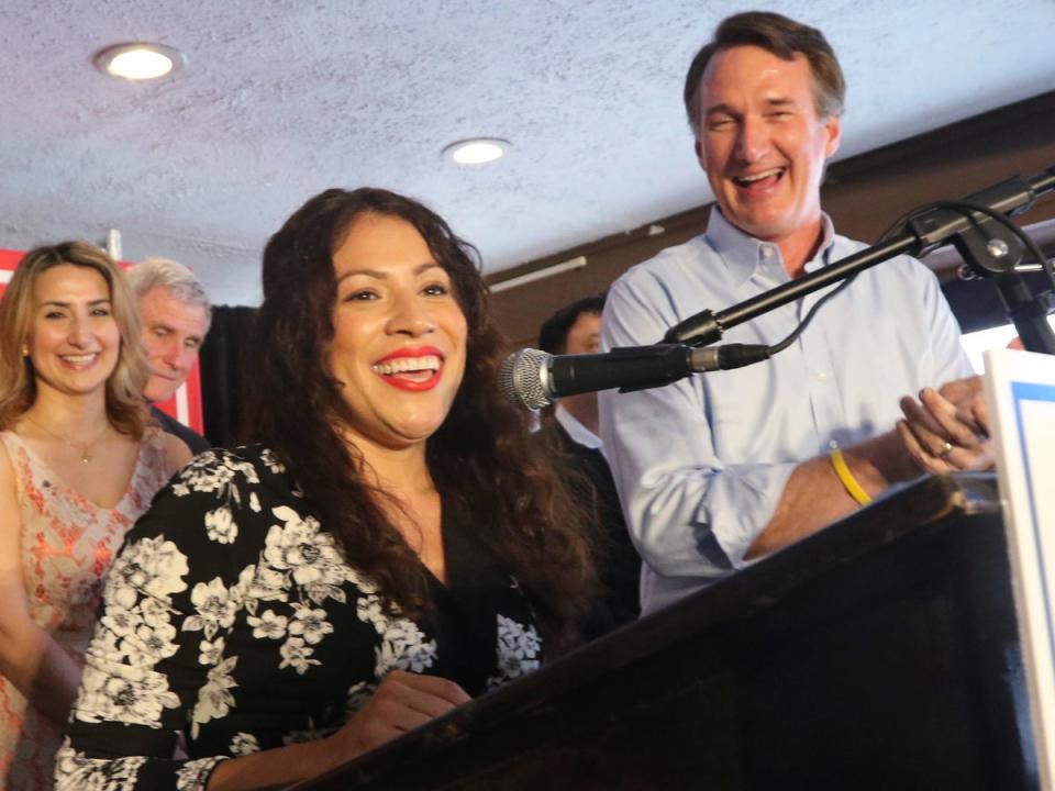 Winner of Tuesday's Republican primary for the 7th district congressional race, Yesli Vega, left, speaks to the crows along with Virginia Gov. Glenn Youngkin at a restaurant Wednesday, June 22, 2022, in Woodbridge, Va (AP)