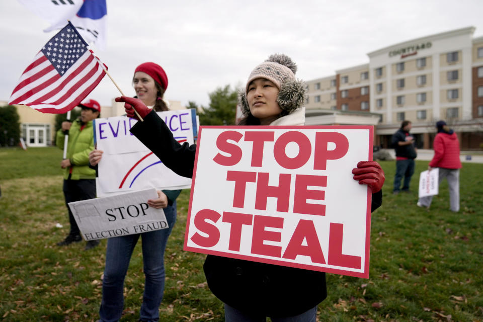 FILE - In this Wednesday, Nov. 25, 2020 file photo, Supporters of President Donald Trump gather outside of the Wyndham Hotel where the Pennsylvania State Senate Majority Policy Committee is scheduled to meet in Gettysburg, Pa. Election officials and experts are raising alarms about the private fundraising surrounding efforts to expand Republican ballot reviews to more states former President Donald Trump falsely claims he won. While some fundraising details have come to light, information about who is donating the money and how it's being spent is largely exempt from public disclosure. (AP Photo/Julio Cortez, File)