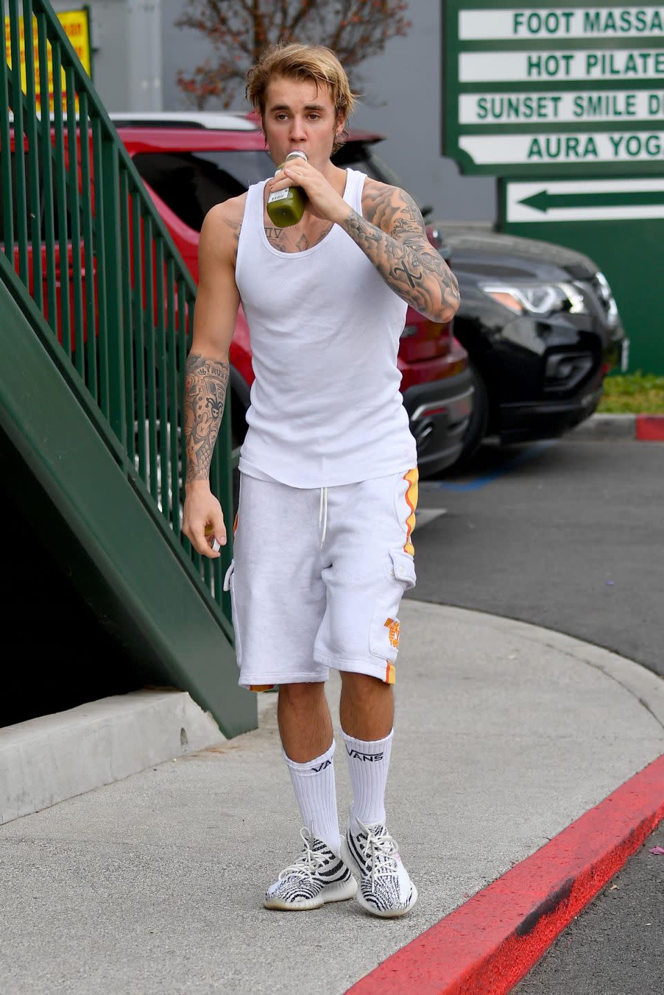 Bieber enjoyed a cold presses green juice after his workout looking a little flustered Source: Backgrid