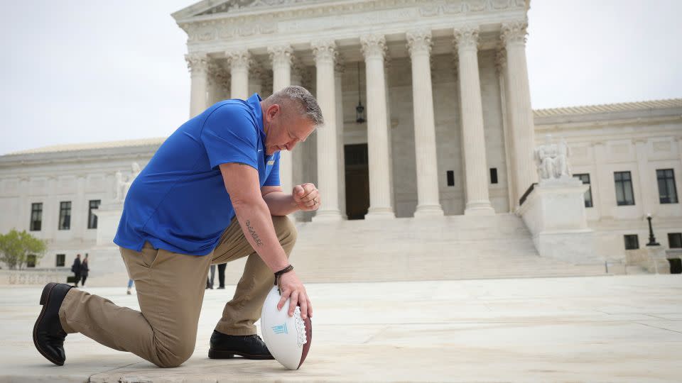 Joe Kennedy takes a knee in front of the US Supreme Court in 2022. - Win McNamee/Getty Images