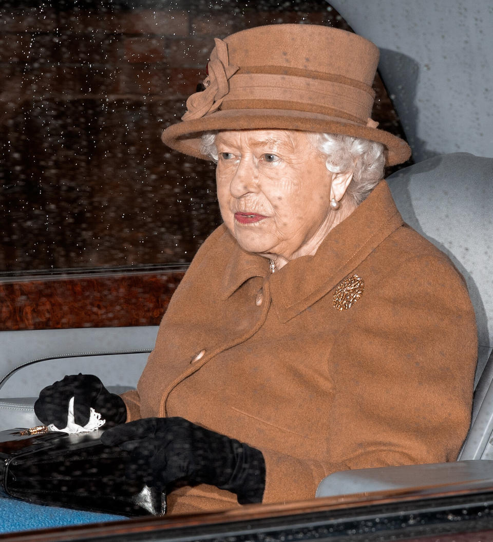 Queen Elizabeth II seen wearing a matching hue to Meghan leaving church in King's Lynn, England, on Jan. 12, days later. (Photo: Max Mumby/Indigo via Getty Images)