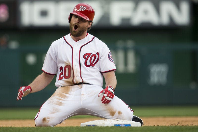 Daniel Murphy reacts after hitting a three-run triple while playing with Washington. [Evan Vucci/AP File Photo]