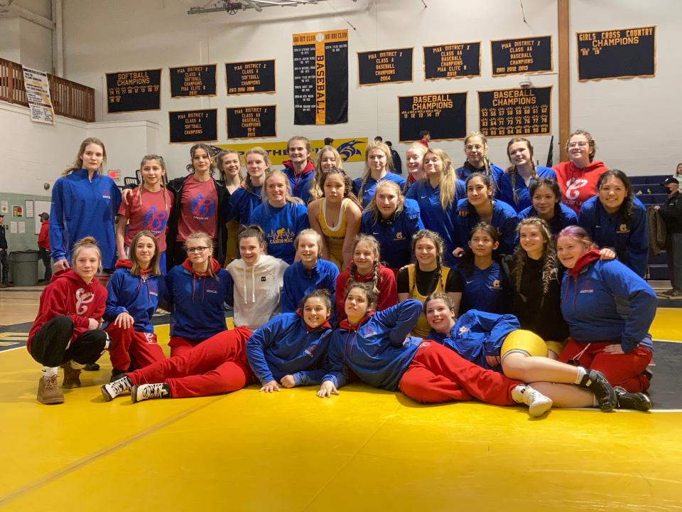 Members of the Crawford Wrestling Club and Canon-McMillan pose after Tuesday's historic dual at Saegertown. Crawford won 48-27. It was the first sanctioned all-girls high school wrestling dual ever held in northwestern Pennsylvania.