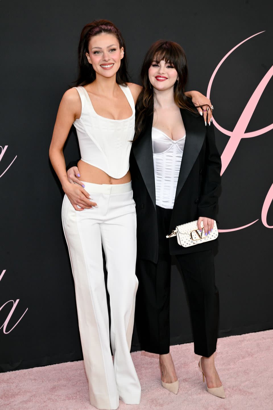 selena gomez and nicola peltz beckham wearing white corsets at the lola premiere