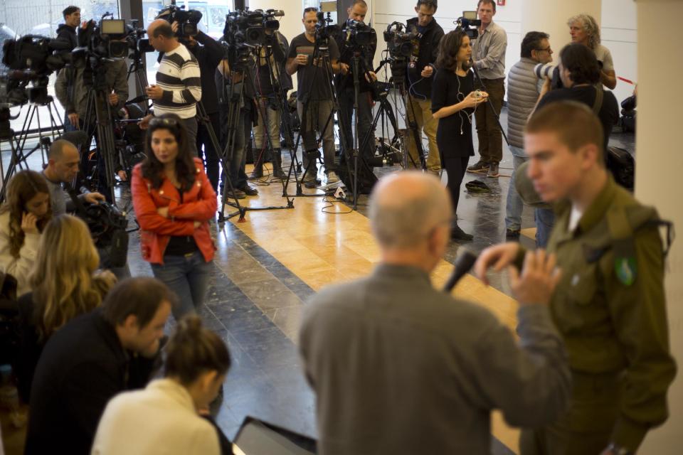 Journalists wait for Zeev Rotstein, the director of Tel Hashomer hospital where the comatose former Israeli prime minister Ariel Sharon is being treated, near Tel Aviv, Israel, Thursday, Jan. 2, 2014. The director of the hospital where Sharon is being treated says he is in critical condition and his life is in danger. Rotstein said Thursday that the functioning of "several essential organs" has declined but would not elaborate. (AP Photo/Ariel Schalit)