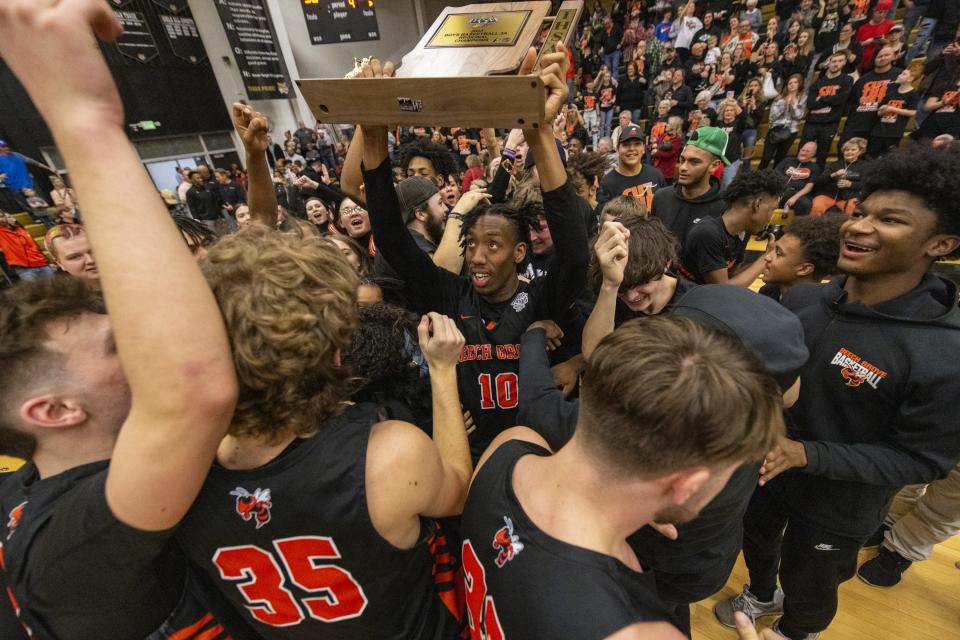 Beech Grove High School senior Jaleel Edwards (10) celebrates with his teammates after defeating Indian Creek High School in an IHSAA Class 3A Regional championship game, Saturday, March 11, 2023, at Lebanon High School. Beech Grove won 65-56.