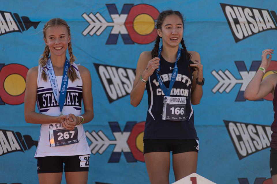 Liberty Common's Isabel Allori smiles through pain after winning the Colorado 3A girls state championship at Norris Penrose Event Center in Colorado Springs, Colo. on Saturday, Oct. 28, 2023.