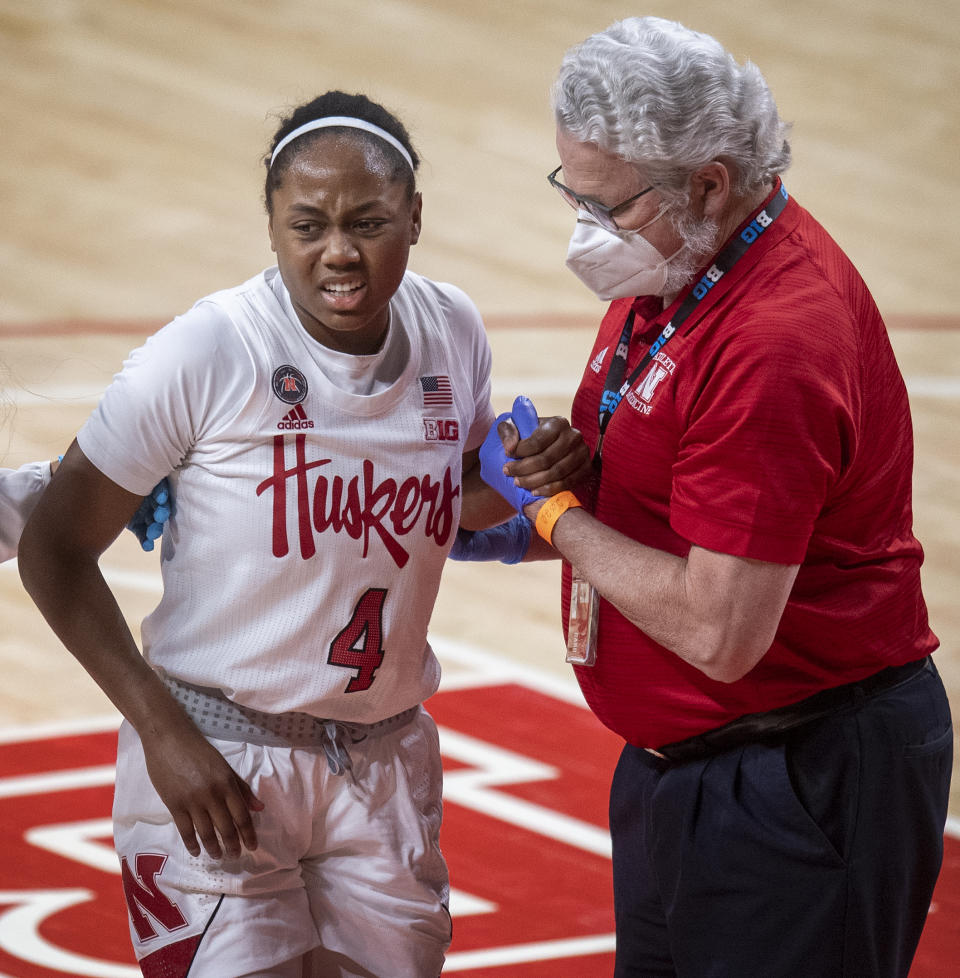 Nebraska's Sam Haiby (4) gets to her feet after getting fouled by Northwestern's Veronica Burton in the fourth quarter of an NCAA college basketball game Thursday, Dec. 31, 2020, in Lincoln, Neb. (Francis Gardler/Lincoln Journal Star via AP)