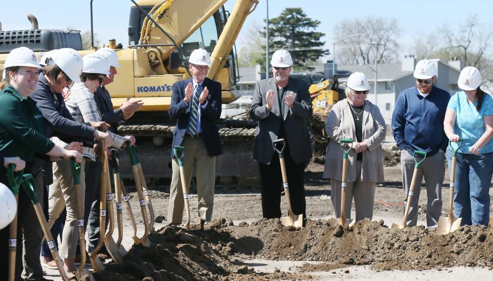 Ames mayor John Haila celebrates with donors and city council members during the groundbreaking ceremony for the Fitch Family Indoor Aquatic Center on Wednesday, April 24, 2024, at 115 N. Elm Ave. in Ames, Iowa.
