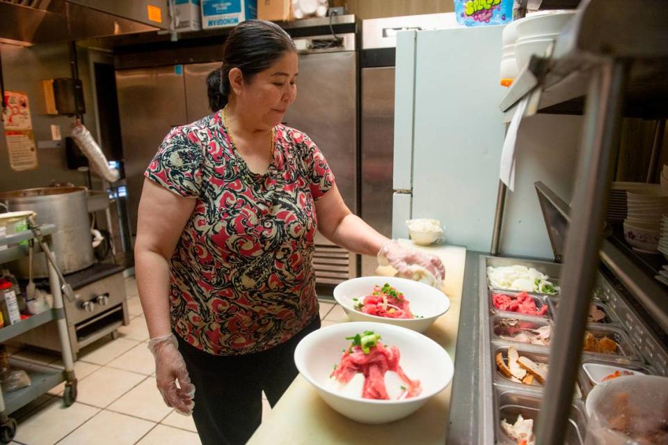 Vung Tau owner Theu Phan prepares bowls of pho at Vung Tau in Biloxi on Thursday, Aug. 3, 2023. Hannah Ruhoff/Sun Herald