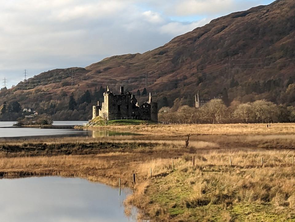 Kilchurn Castle in scotland, view from train window