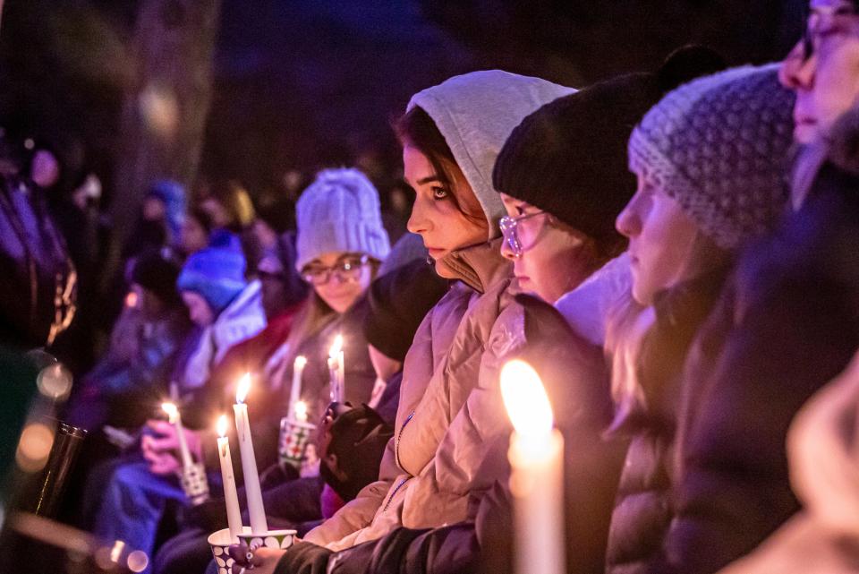 People gather in Waukesha's Cutler Park for a candlelight vigil on Monday, Nov. 22, for those affected by the Waukesha Christmas Parade tragedy.