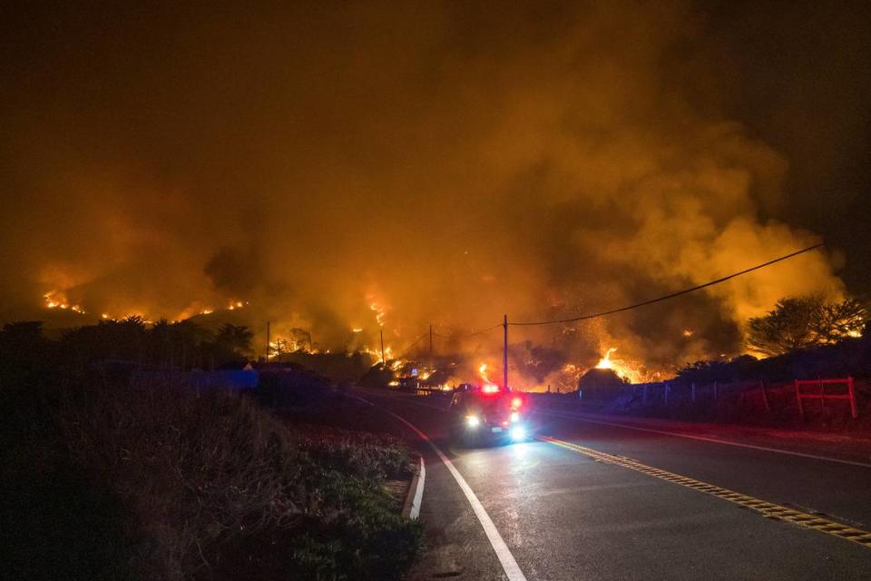 The Colorado Fire burns along Highway 1 near Big Sur, Calif., Saturday, Jan. 22, 2022. (AP Photo/Nic Coury)