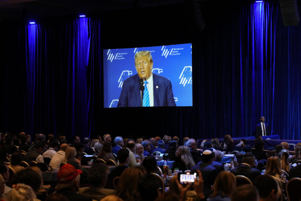 People listen as Republican presidential candidate and former President Donald Trump speaks at an annual leadership meeting of the Republican Jewish Coalition, Saturday, Oct. 28, 2023, in Las Vegas. (AP Photo/John Locher)