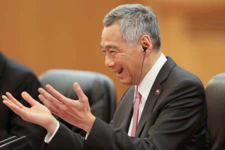 FILE PHOTO: Singapore Prime Minister Lee Hsien Loong attends a meeting with Chinese Premier Li Keqiang (not pictured) at The Great Hall of the People in Beijing, China September 19, 2017. REUTERS/Lintao Zhang/Pool/File Photo