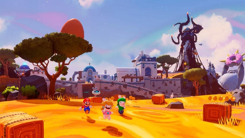 Mario and some Rabbids run across a landscape.