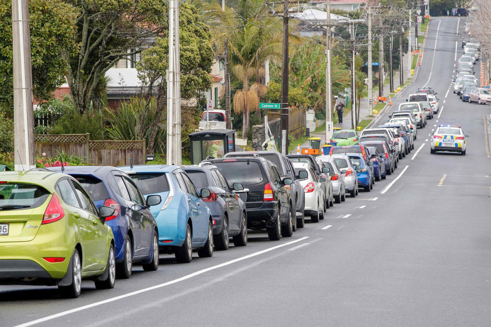 Image: Motorists queue at a COVID-19 coronavirus testing centre in the suburb of Northcote in Auckland, New Zealand (David Rowland / AFP - Getty Images)