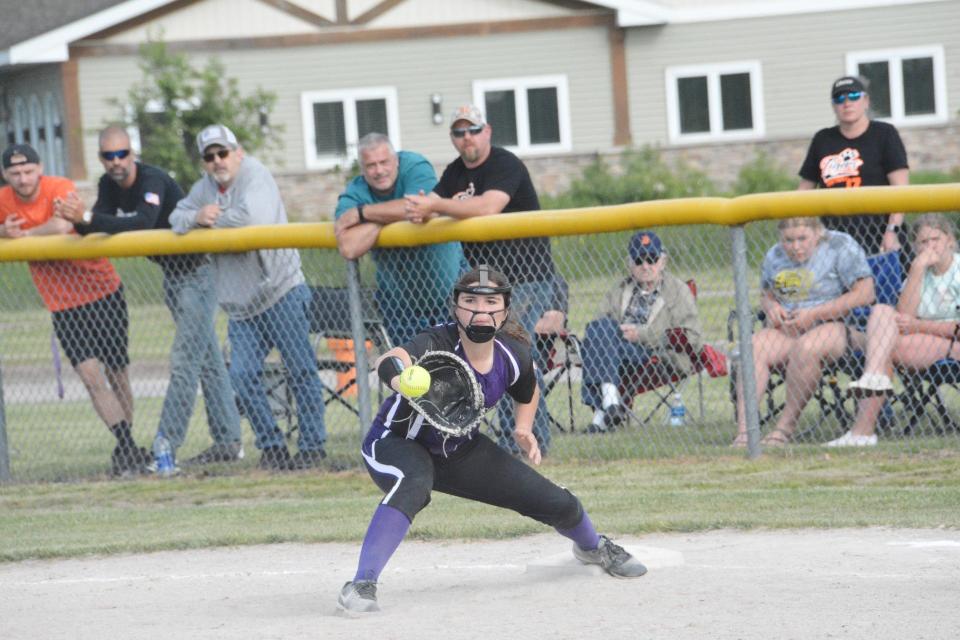 Laura Bush of Pickford makes the catch at first base for a force out against Hillman Tuesday. The Panthers downed the Tigers 5-4 in a quarterfinal game.