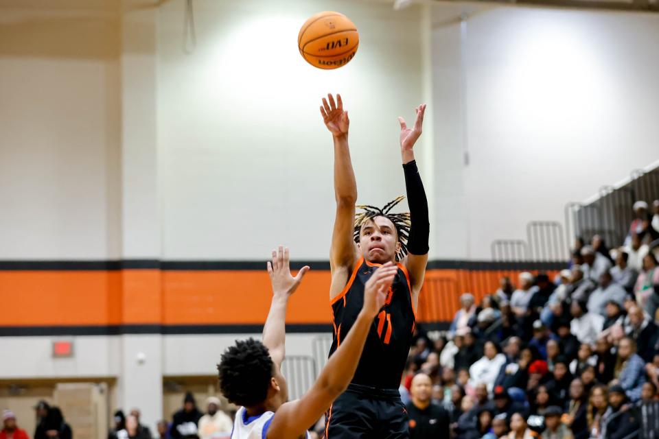 Douglass’ Davon Scott-Jones (11) shoots the ball during a high school basketball game between Douglass and Millwood in Oklahoma City, on Saturday, Jan. 13, 2024.