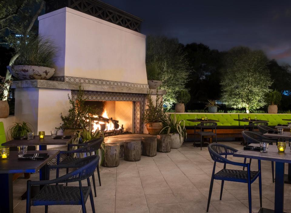 A large fireplace adds ambiance to the outdoor dining patio at El Camino restaurant's new Boca Raton location.