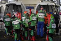 A children's ski club board gondolas for Plan de Corones ski area, in San Vigilio di Marebbe, Italy, South Tyrol, Saturday, Nov. 27, 2021. After nearly two years of being restricted to watching snow accumulate on distant mountains, Italian skiers are finally returning to the slopes that have been off limits since the first pandemic lockdown in March 2020. But just as the industry is poised to recover from a lost 2020-2021 season after an abrupt closure the previous year, a spike in cases in the Alpine province bordering Austria is underlining just how precarious the situation remains. (AP Photo/Luca Bruno)