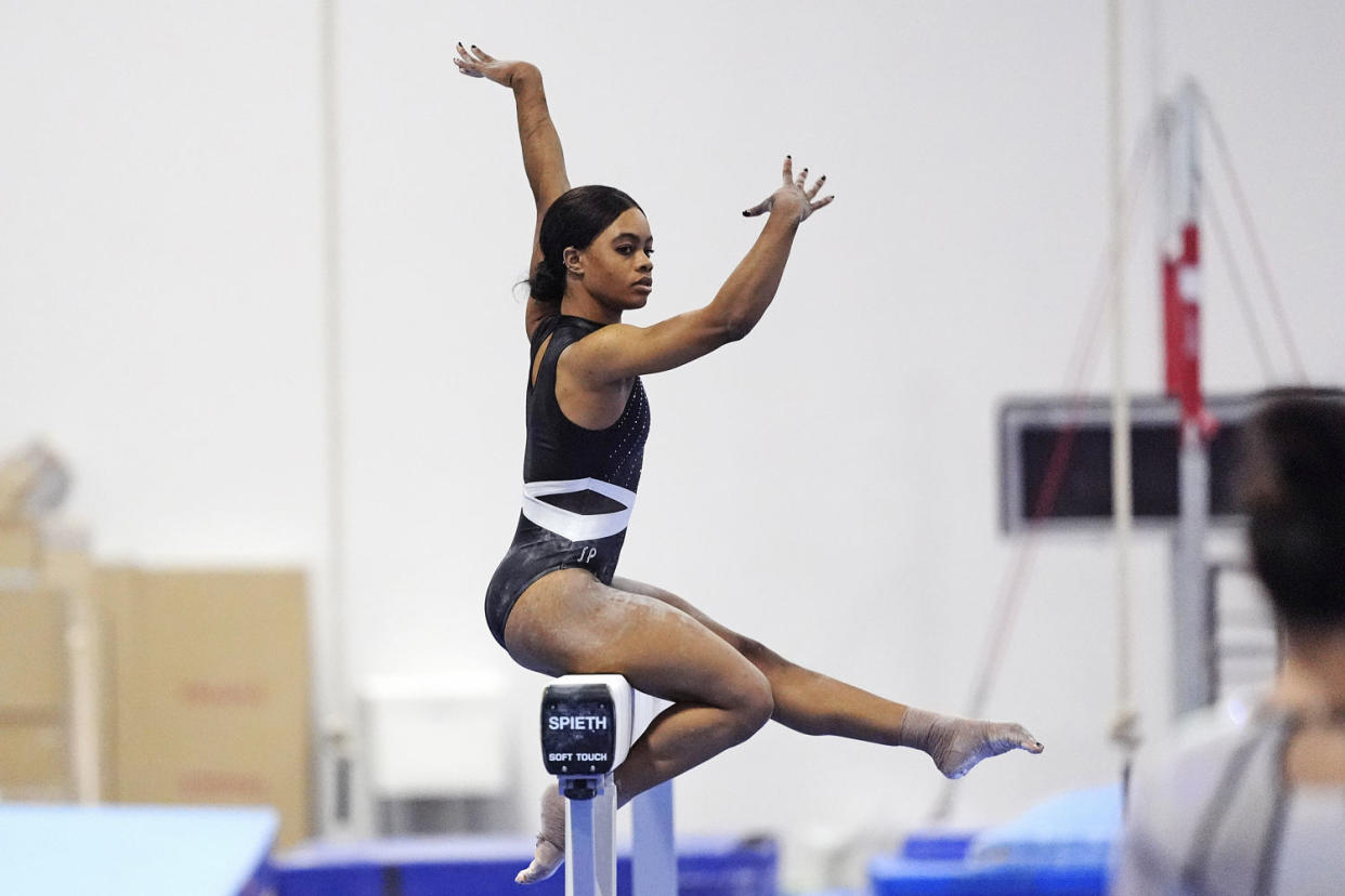 Gabby Douglas competes on the balance beam  (David J. Phillip / AP)