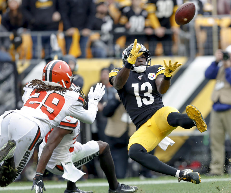 Pittsburgh Steelers wide receiver James Washington (13) makes a touchdown catch in front pop Cleveland Browns defensive back Sheldrick Redwine (29) during the first half of an NFL football game, Sunday, Dec. 1, 2019, in Pittsburgh. (AP Photo/Don Wright)