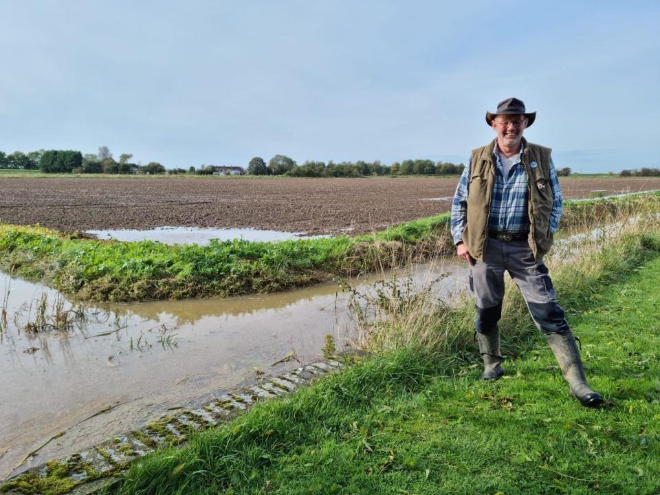 Stuart Peltell of the Wainfleet Flood Advisory Group next to the dams, which were still full on Monday.  (Photo: Chrissy Redford)