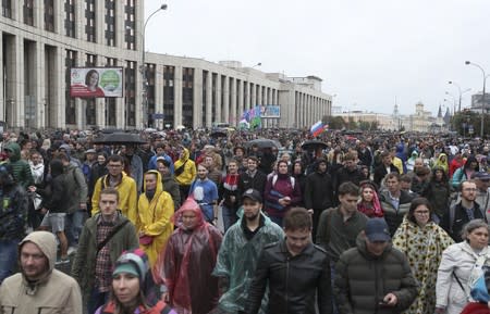 People attend a rally to demand authorities allow opposition candidates to run in a local election in Moscow