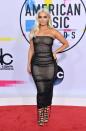 <p>Blonde bombshell and Kylie Jenner lookalike Bebe Rexha showed off her curves in a tight midi-length sparkly black dress.</p>