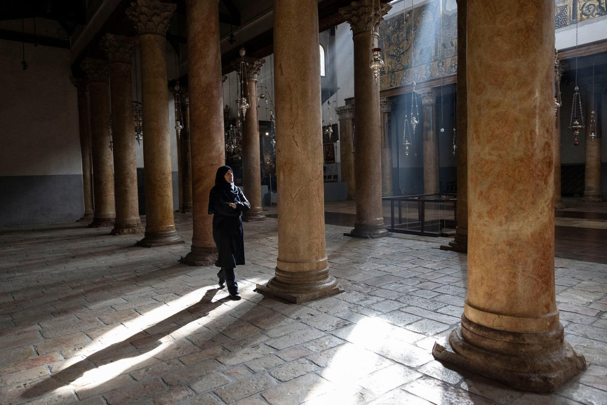 A worshiper walks in empty Church of Nativity on Dec. 25, 2023 in Bethlehem, West Bank. (Maja Hitij / Getty Images)