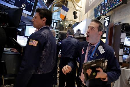 Traders work on the floor of the New York Stock Exchange (NYSE) February 9, 2016. REUTERS/Brendan McDermid