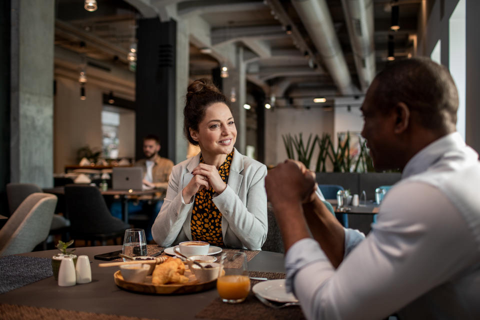 Two colleagues having lunch together