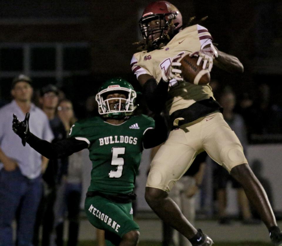 Lake Gibson's Sam McCall comes down with the interception in front of Melbourne's Jalen Clarke