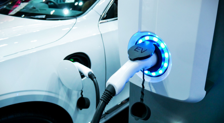 Power supply connect to electric vehicle for charge to the battery. Charging technology industry transport which are the futuristic of the Automobile. EV fuel Plug in hybrid car.