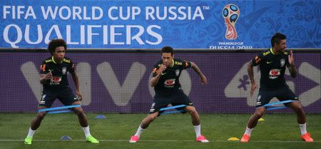 Brazil's national soccer team training - World Cup 2018 Qualifiers - arena Corinthians stadium, Sao Paulo, Brazil - 26/3/17. Paulinho (R), Neymar and Willian (L) attend a training session. REUTERS/Paulo Whitaker