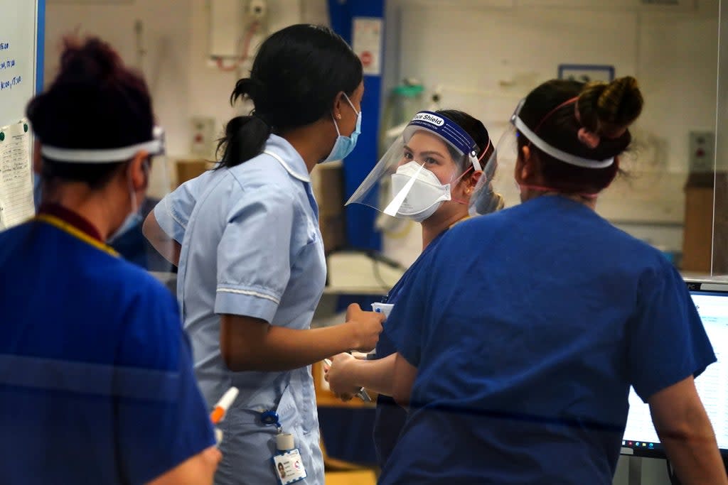 Medical staff wearing PPE on a ward for Covid patients at King’s College Hospital, in south east London (Victoria Jones/PA) (PA Wire)