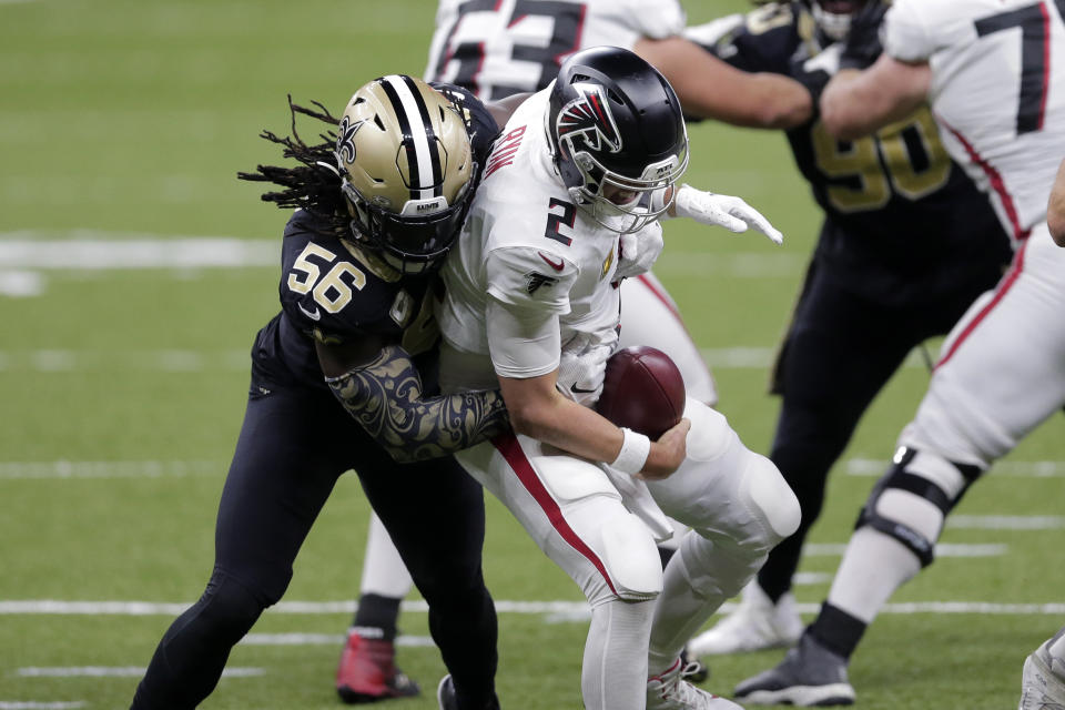 Atlanta Falcons quarterback Matt Ryan (2) is sacked by New Orleans Saints outside linebacker Demario Davis (56) in the second half of an NFL football game in New Orleans, Sunday, Nov. 22, 2020. (AP Photo/Brett Duke)