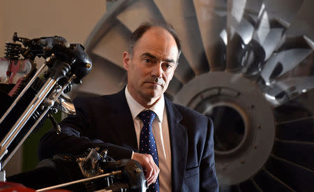 Warren East, CEO of Rolls-Royce, poses for a portrait in front of a Pegasus airplane engine at the company's aerospace engineering and development site in Bristol, Britain, December 17, 2015. REUTERS/Toby Melville/File Photo